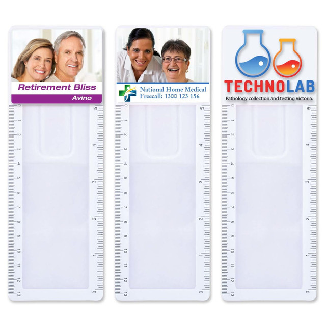 A clear, plastic bookmark magnifier ruler featuring three sections with varying designs and a logo on each section. A clear, plastic bookmark magnifier ruler featuring three sections with varying designs and a logo on each section.