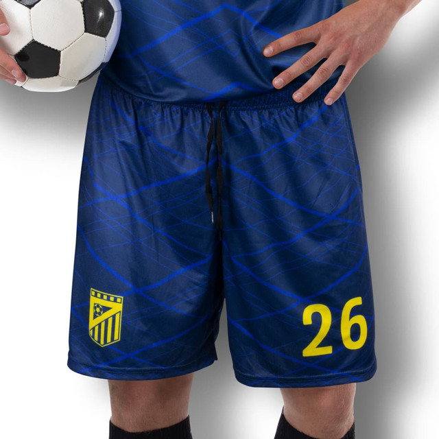 Custom men's soccer shorts in navy blue with a pattern, featuring a yellow number and logo. A soccer ball is held. Custom men's soccer shorts in navy blue with a pattern, featuring a yellow number and logo. A soccer ball is held.
