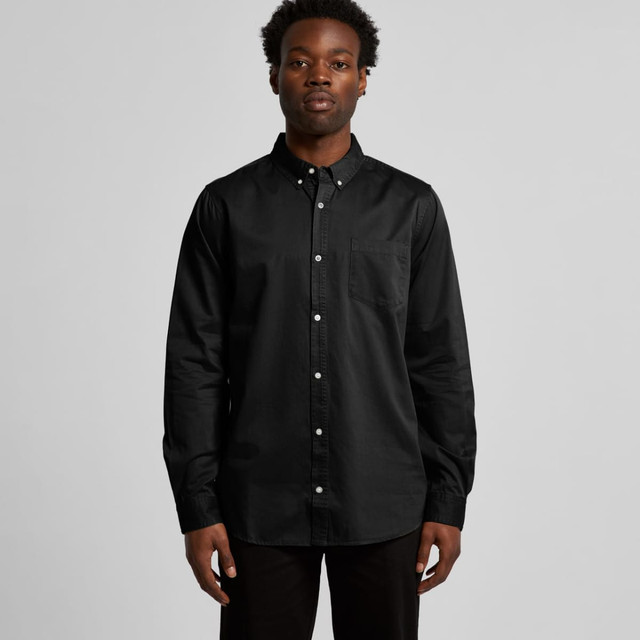 A black denim wash shirt with a button-up front and long sleeves, featuring a pocket and a logo.