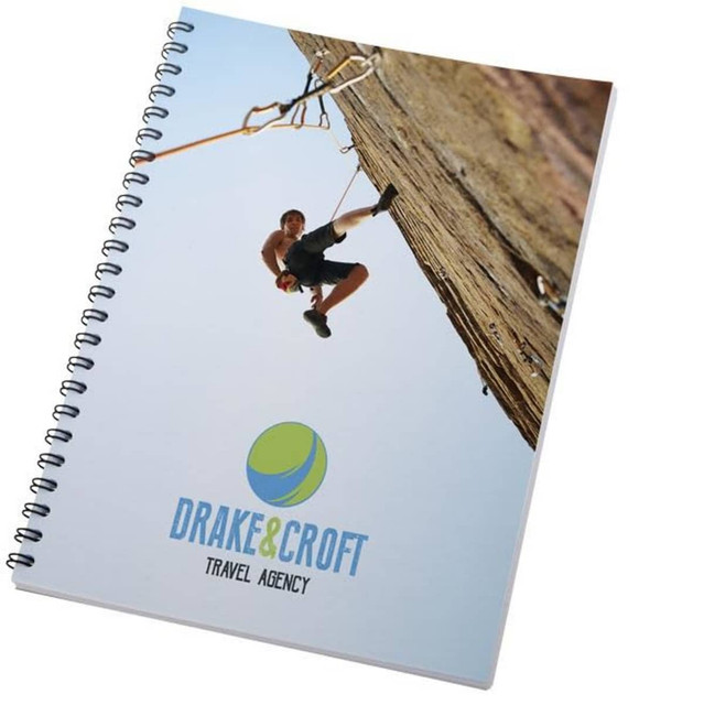 A wiro (spiral) bound A4 notebook with a climbing-themed cover and a branding logo. Features a vibrant colour design. A wiro (spiral) bound A4 notebook with a climbing-themed cover and a branding logo. Features a vibrant colour design.