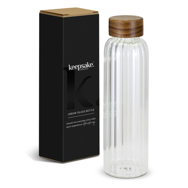 A drink bottle made of clear glass with a ribbed design and a wooden lid, packaged in a black box with branding. A drink bottle made of clear glass with a ribbed design and a wooden lid, packaged in a black box with branding.
