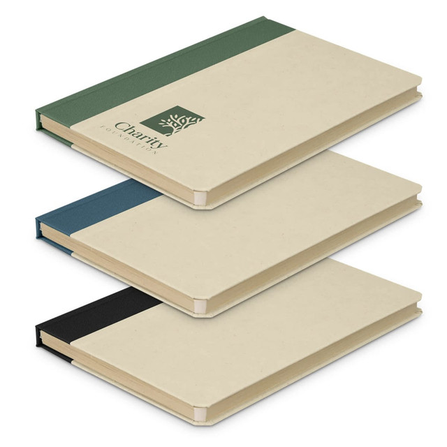 Three notebooks stacked together in cream, blue, green, and black colours, featuring a branding logo on one.