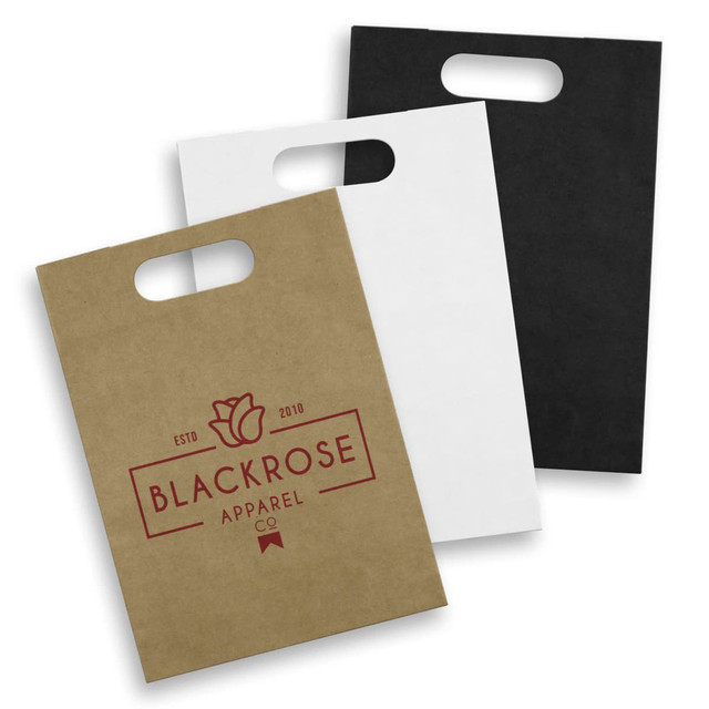 Large die cut paper bags in brown, white, and black with a handle and a logo on the front. Large die cut paper bags in brown, white, and black with a handle and a logo on the front.