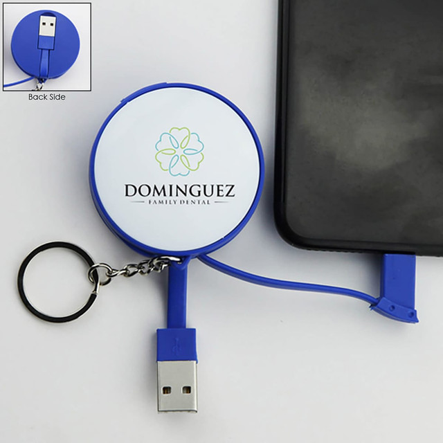 A blue charging cable key ring with a retractable USB connector and a branding logo on one side.