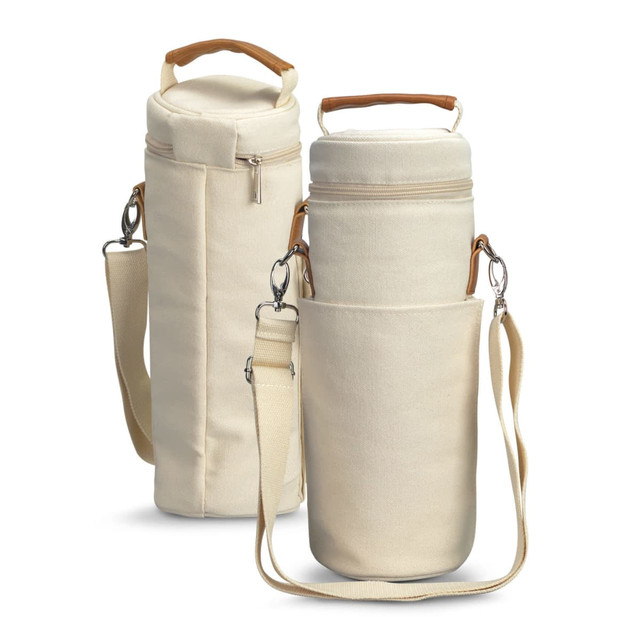 A cream-coloured wine cooler bag with a removable shoulder strap and a wooden handle, featuring a zip closure and a side pocket. A cream-coloured wine cooler bag with a removable shoulder strap and a wooden handle, featuring a zip closure and a side pocket.