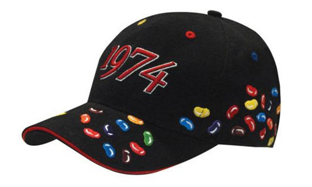 A black cap featuring colourful jelly bean embroidery and the year "1974" stitched on the front.