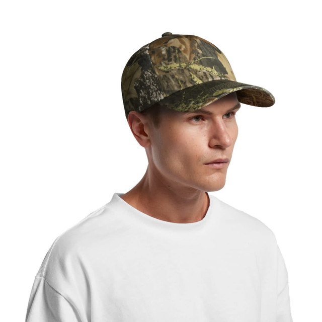 A camo cap featuring a blend of green and brown tones, designed for outdoor wear. It has a logo on the front.