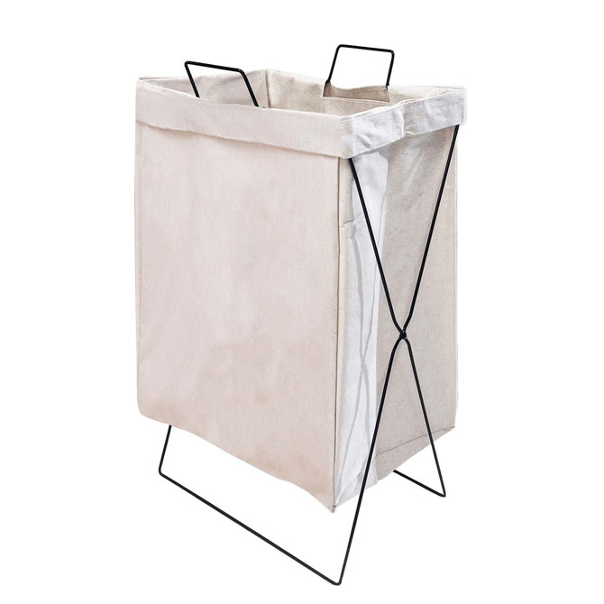 A light beige cotton laundry basket with a black metal frame and handles, featuring a minimalist design.