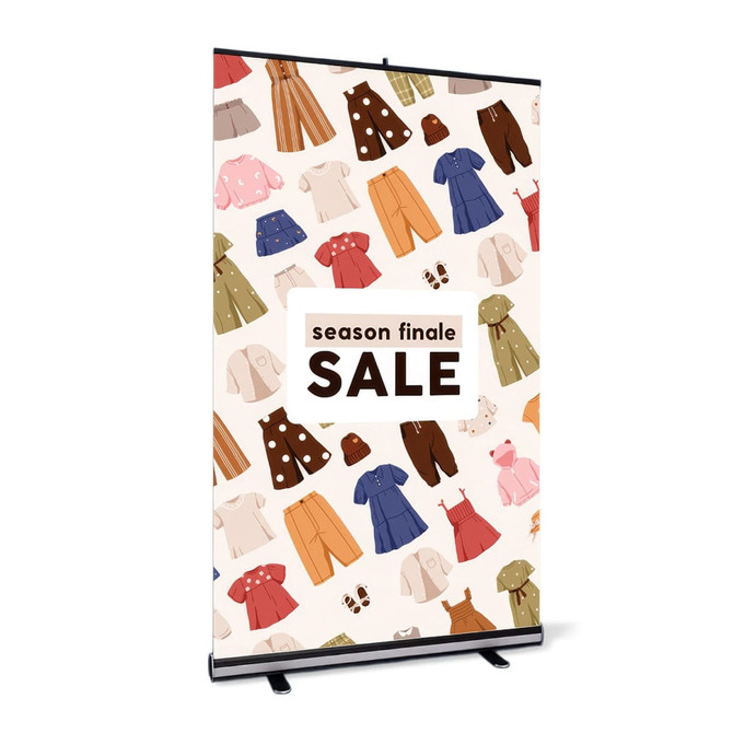 A pull-up banner stand featuring a pattern of colourful clothing items on a light background, with a logo at the top.