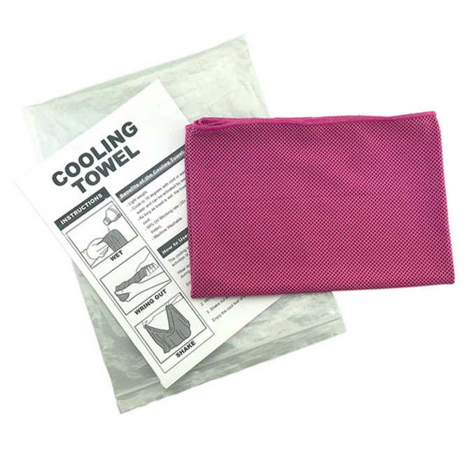 A pink cooling towel packaged with instructions, sitting in a clear wrap.