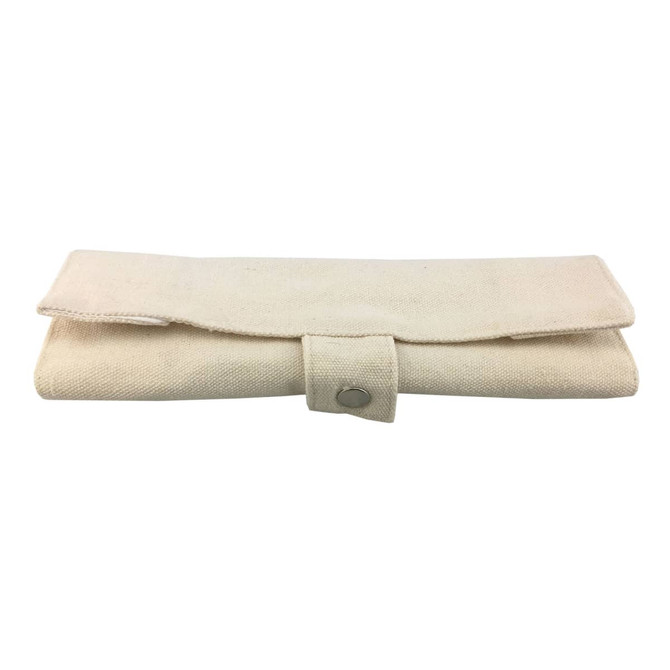 A beige, foldable utensil pouch with a button closure for holding bamboo utensils.