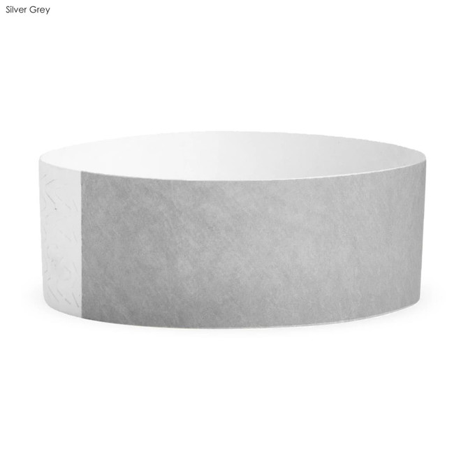 A silver grey Tyvek adult wristband, featuring a simple design and an embossed logo on one side.
