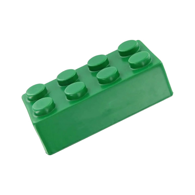 A green stress-building block resembling a LEGO piece, featuring rounded studs on top and a solid base.