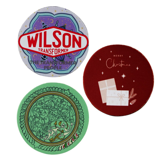 Three 5mm neoprene coasters in green, red, and a multi-coloured design, featuring various patterns and a logo.
