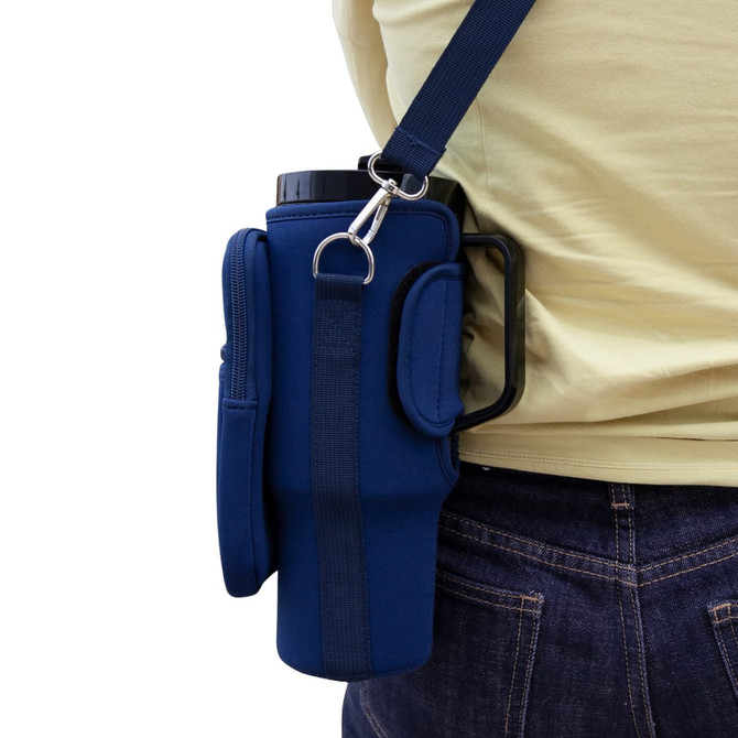 A drink bottle carrier in navy neoprene, featuring a shoulder strap and a side handle for easy transport.
