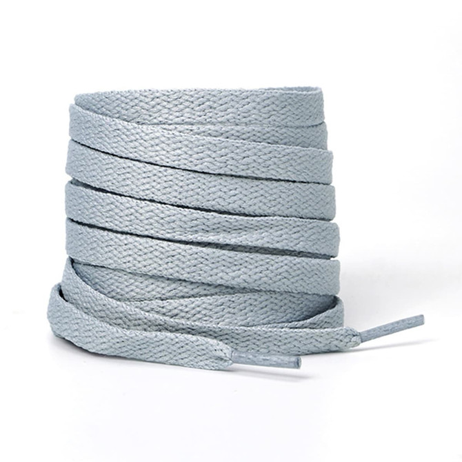 A bundle of light blue shoelaces stacked neatly, featuring a textured finish. The item has a logo visible.