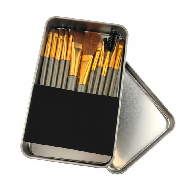 A 12-piece brush set in a metallic box, featuring brushes with gold and silver handles. The box has a black band on it.