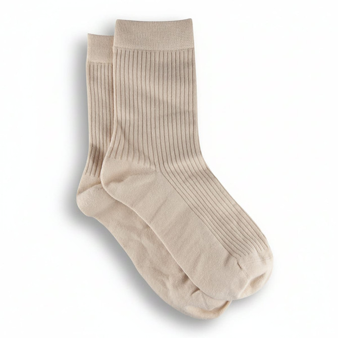 A pair of beige ribbed lounge socks displayed together, featuring a branding logo.