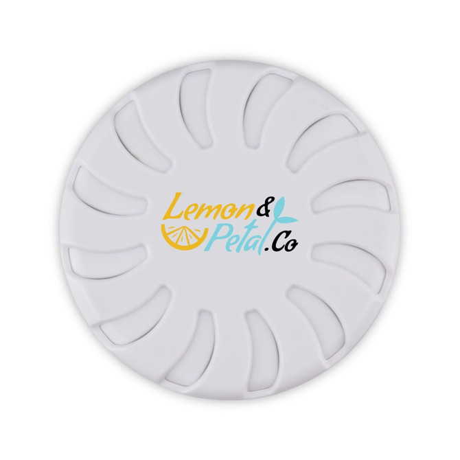 A round white fragrance pot with a floral design and a logo featuring "Lemon & Petal Co".