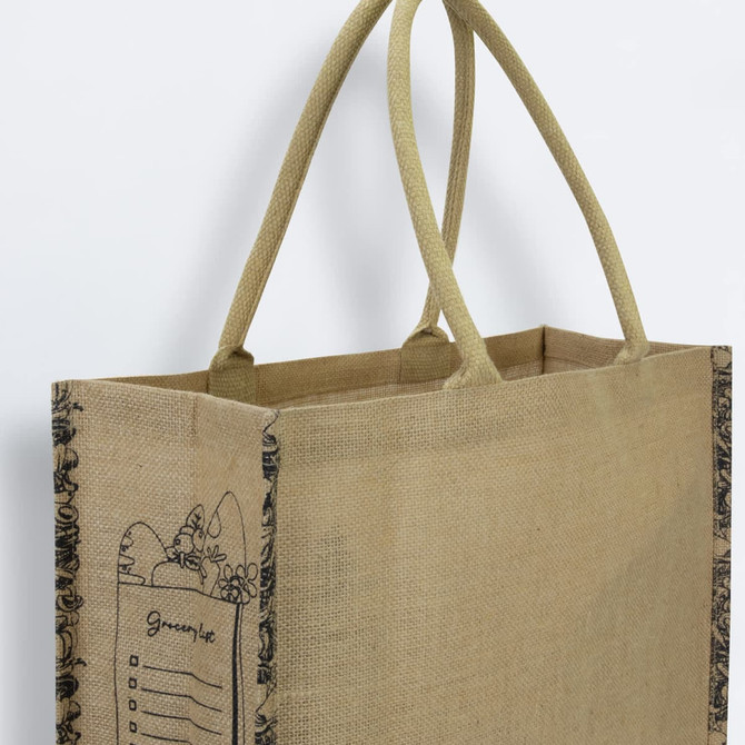 A jute tote bag in a natural colour with decorative detailing and two sturdy handles. It features a branding logo.