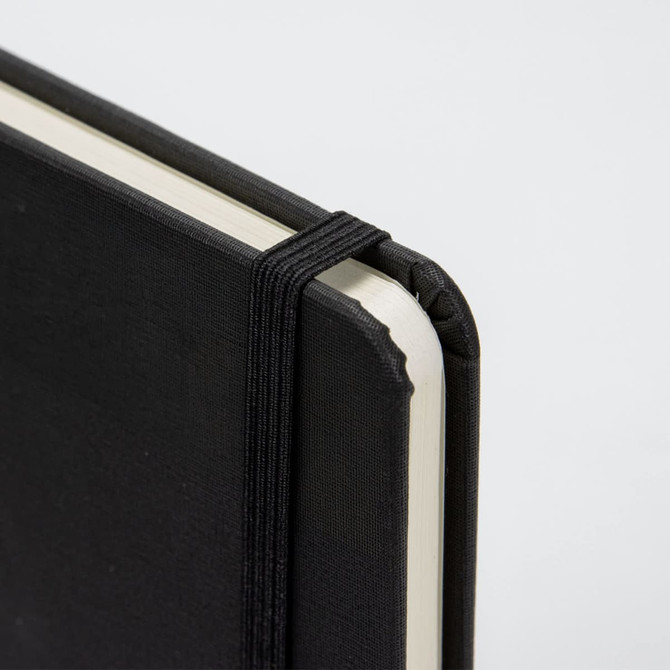 A black A4 daily diary with a textured cover and an elastic band closure, featuring a rounded spine.
