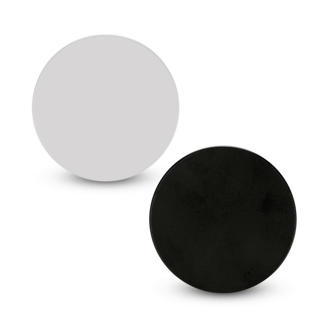 A set of two circular badges, one in black and one in grey, with a smooth surface and a logo on each.
