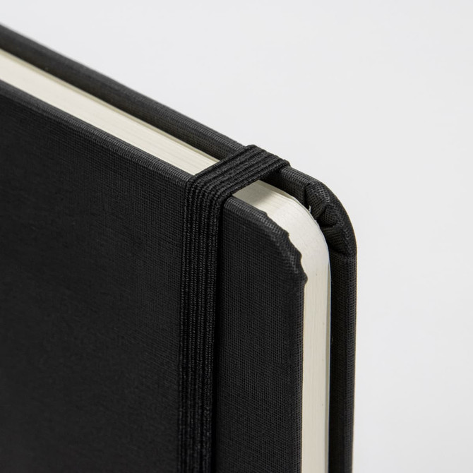 A5 weekly diary in black with a textured cover and an elastic band closure, featuring rounded corners.