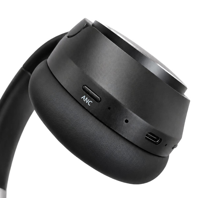 Aero by Nomis headphones in black, featuring a padded earcup with buttons and a USB-C port.