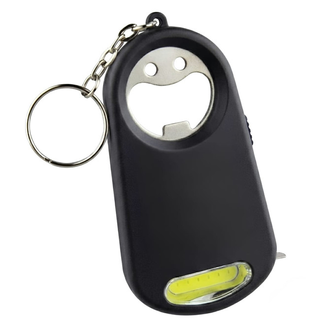A drink bottle opener key ring in black, featuring a smiling face design and a built-in light at the bottom.