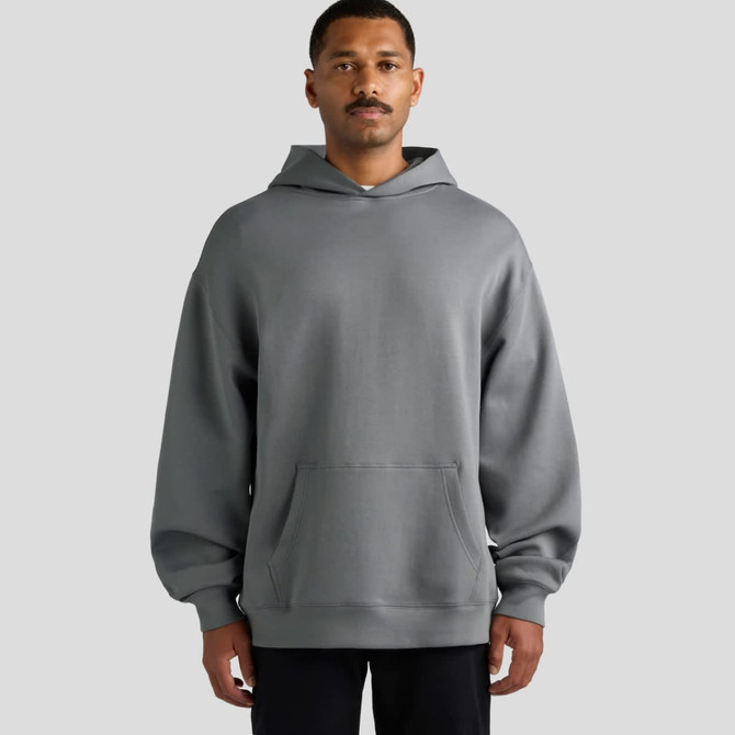 A grey hooded sweatshirt with a front pocket, featuring a relaxed fit and long sleeves. It has a logo on the sleeve.