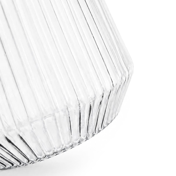 A drink bottle featuring a clear, ribbed design with a geometric shape and a logo.