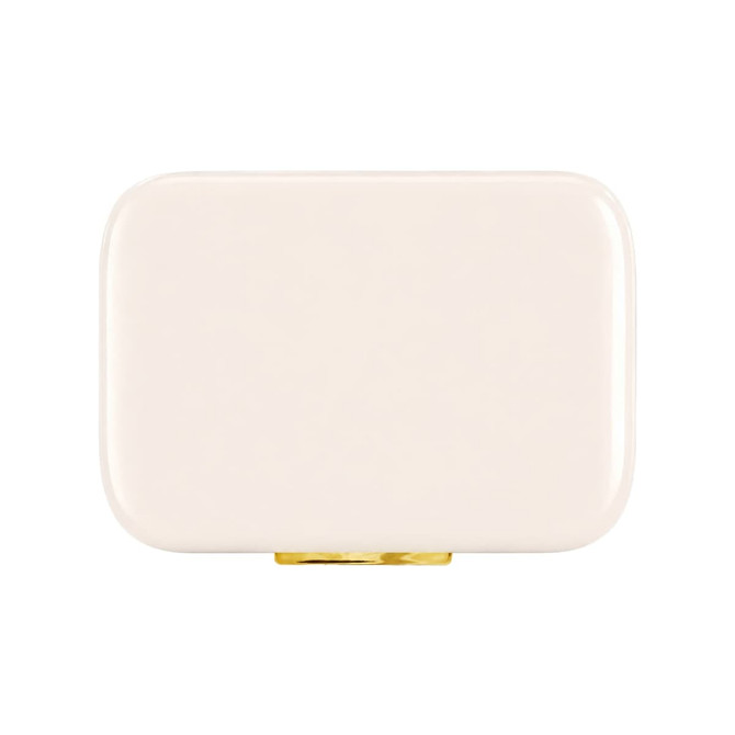 A cream rectangular cooler with a gold clasp, featuring a logo on the surface.