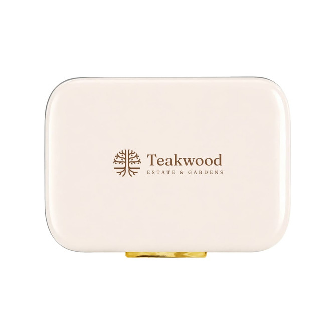 A cream-coloured cooler with a gold clasp and a logo featuring a tree design.