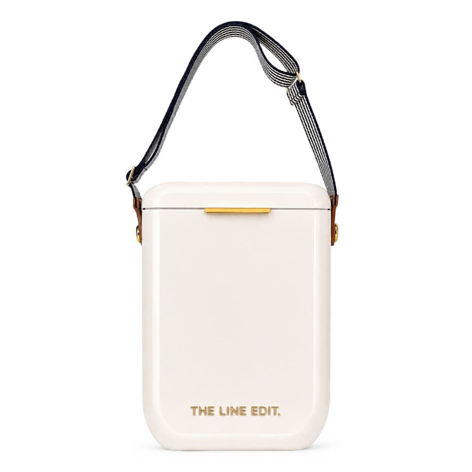 A cooler in a sleek, off-white colour with a striped strap and a gold accent. It features a branding logo.