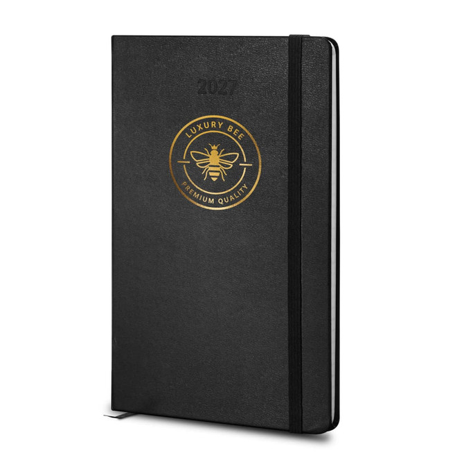 A black 2027 planner with a gold emblem and an elastic band for closure, designed for weekly planning.