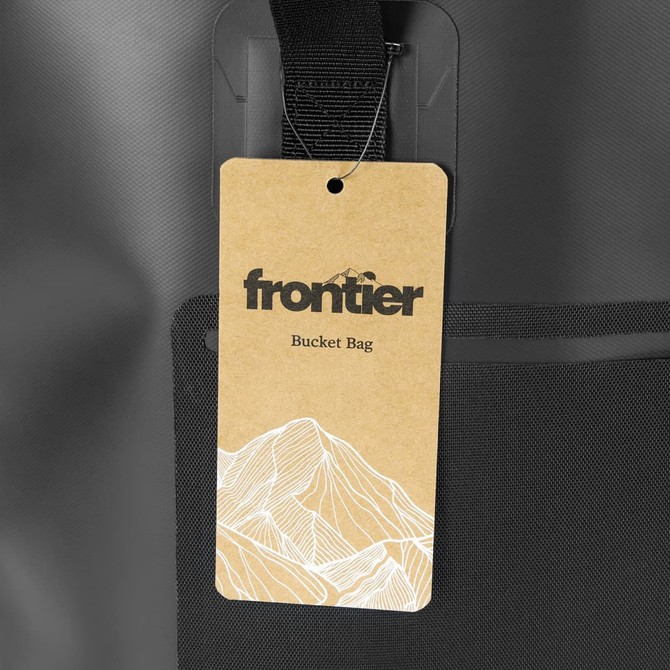 A black bucket bag with a tag featuring a logo and a design inspired by mountains.