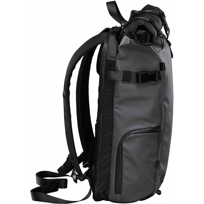 A roll top backpack in black, featuring adjustable straps, a side pocket, and a sturdy design. It has a logo shown.
