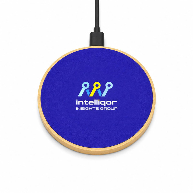 A wireless charger with a circular design, featuring a blue suede top and wooden base, including a logo.