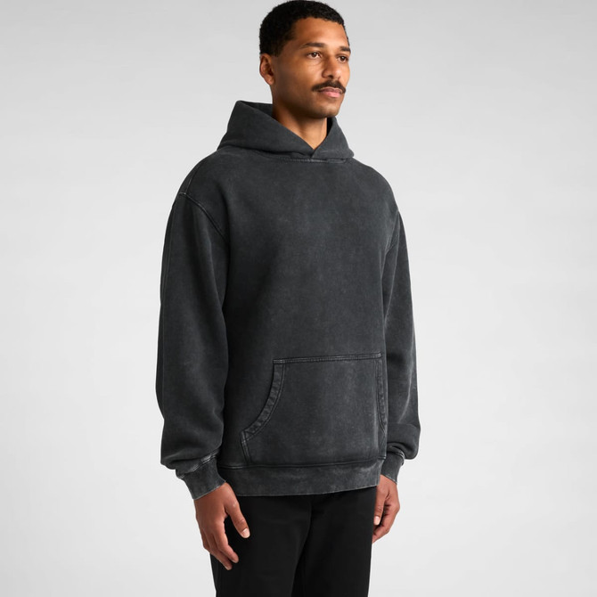 A grey stone wash hoodie with a front pocket and a hood, featuring a relaxed fit. The model stands against a neutral background.