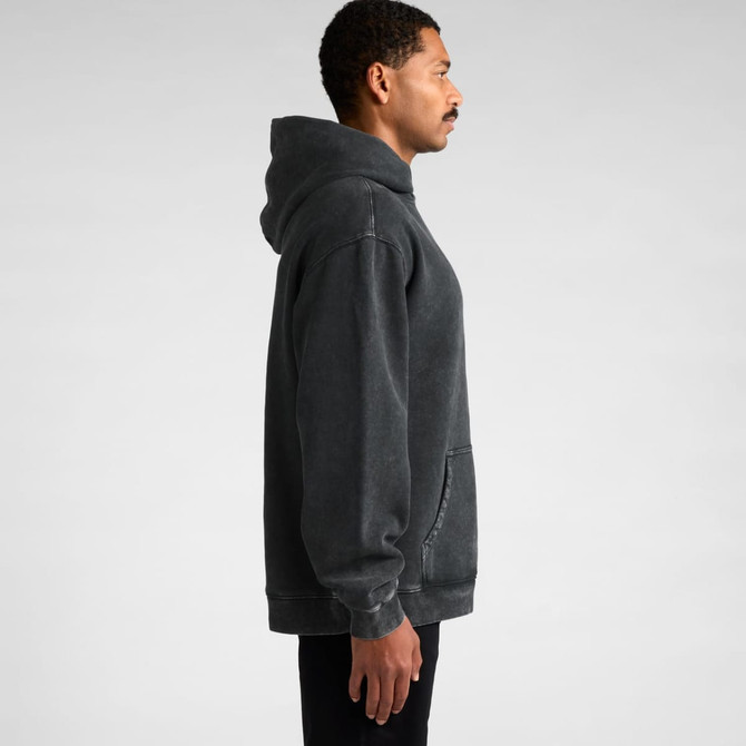 A side view of a grey stone-washed hoodie with a hood and a front pocket. The model stands with a neutral expression.
