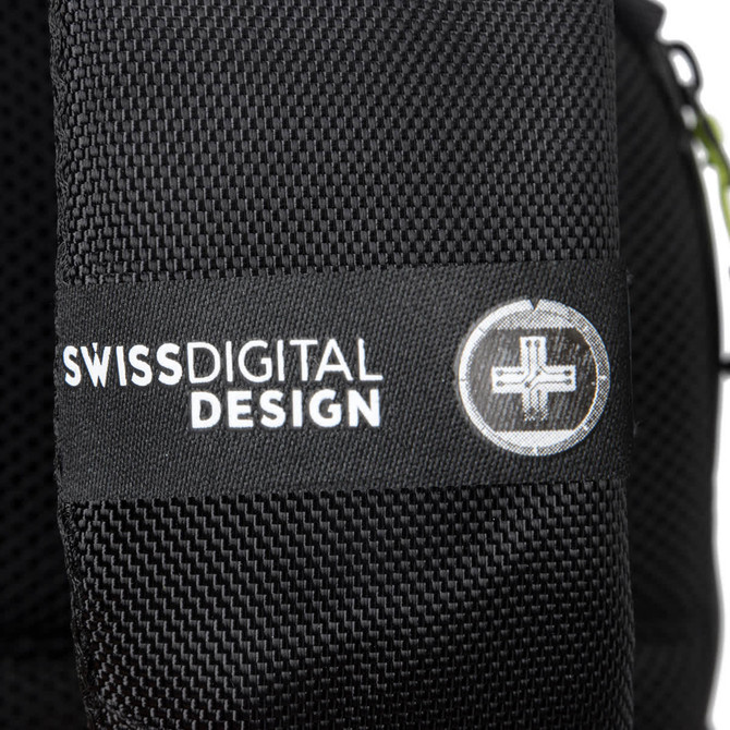 A close-up of a black backpack featuring a textured surface and a branding label.