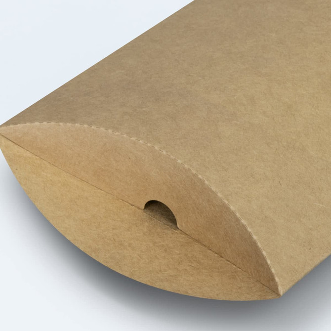 A small, brown pillow box with a rounded top and a cut-out for easy opening.