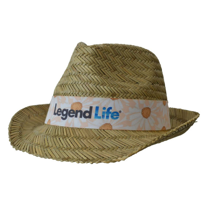 A straw fedora hat in beige with a patterned band featuring a logo. The hat has a classic wide brim design.