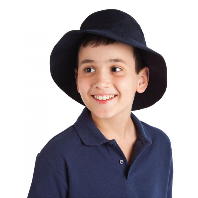 A child wearing a navy blue bucket hat, smiling, with a black polo shirt. The hat has a logo on it.