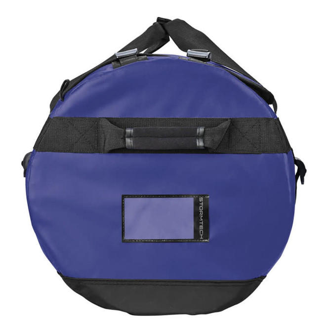 A purple waterproof gear bag with black accents and a handle, featuring a logo and a transparent identification panel.