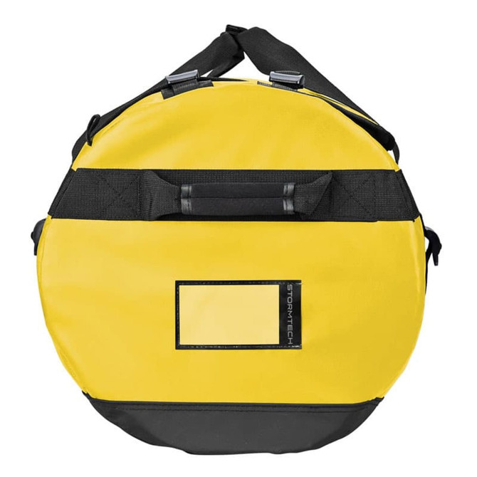 A round, medium-sized waterproof gear bag in yellow and black, featuring a logo and sturdy handles.