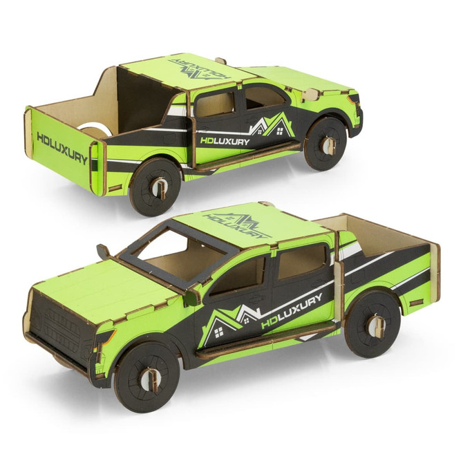 A wooden model of a green and black ute with detailed features and a logo. Perfect for fun and games.