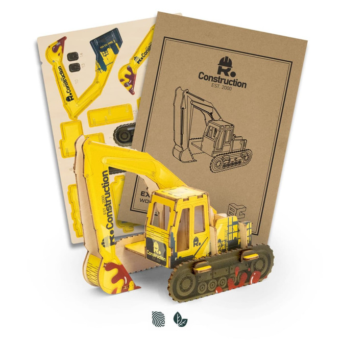 A yellow wooden excavator model with detailed parts, displayed with instructional packaging featuring construction graphics.