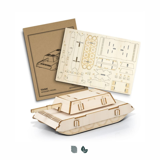 A wooden tank model kit in beige with cut-out pieces and assembly instructions on a cardboard sheet.