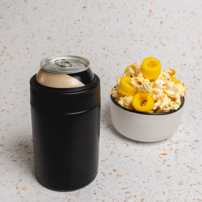 A black stainless steel drink cooler with a can beside a bowl of popcorn topped with yellow snacks.